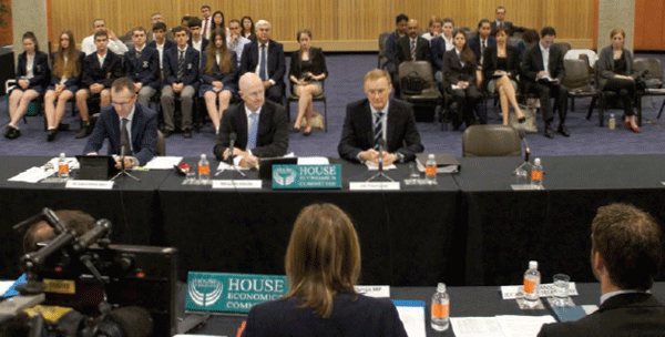 Assistant Governor (Economic) Christopher Kent, Governor Glenn Stevens and Deputy Governor Philip Lowe at a hearing of the House of Representatives Economics Committee in March 2014