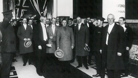 Photograph showing His Royal Highness the Prince of Wales being received at the entrance to the Commonwealth Bank's Head Office by the Governor-General and Sir Denison Miller (Governor, Commonwealth Bank) for the Governor-General's dinner held in his honour, 16 June 1920.