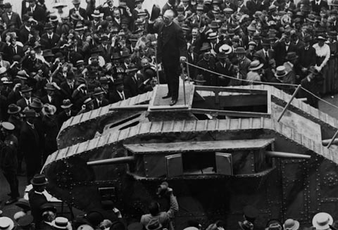 The Lord Mayor of Sydney, Sir James Joynton Smith, delivers a speech on top of a tank for ‘Tank Week’, held in April 1918. The Australian public helped to finance the First World War by lending their country money in exchange for war bonds, which were intended to ‘save brave lives, to shorten the war, and to ensure victory and peace’ (W.A. Watt, Treasurer, March 1918). The Commonwealth Bank of Australia managed the operation on behalf of the government.