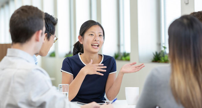 A group of economists having a conversation