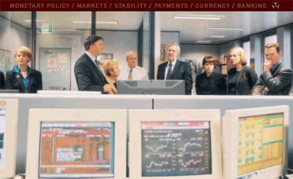 In August 2001, members of the House of Representatives Standing Committee on Economics, Finance and Public Administration visited the RBA. They are pictured in the international dealing room, from right: Christopher Pyne; Tanya Plibersek; Anna Burke; Ian Macfarlane, Governor; Mike Sinclair, Chief Manager, International Department; Kay Hull; David Hawker, Committee Chairman; Margaret Atkin, Committee Secretariat.