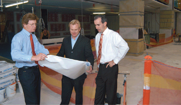 Paul Barry, Information Department, and Ed Jacka, Facilities Management Department, review progress on the construction work for the Museum, with one of the outside contractors (centre).