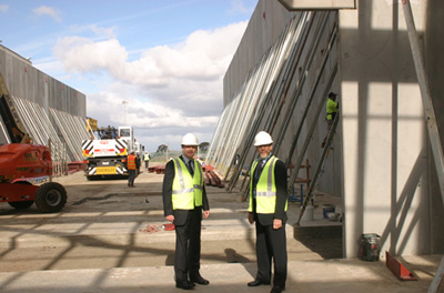 Photograph: Graeme Thompson, Chairman, right, and Myles Curtis, Managing Director, left, assess progress during construction of Securency's plant expansion.