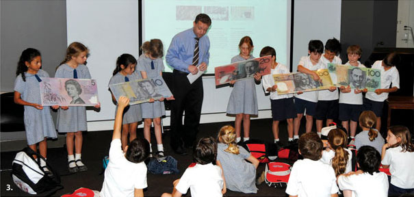 Photo of Terence Turton (Note Issue Department) conducting a school presentation on banknotes.