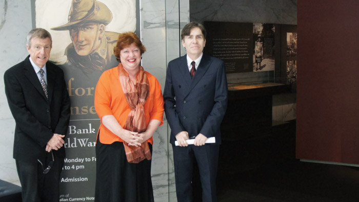 (From left) Information Department's Jeff Connors, Virginia MacDonald and John Murphy at the Before Sunset: The Bank and World War I exhibition, Museum of Australian Currency Notes, November 2014