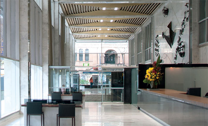 The foyer of the Head Office building in Sydney, viewed from the banking chamber, with Bim Hilder's ‘wall enrichment’ sculpture on the right