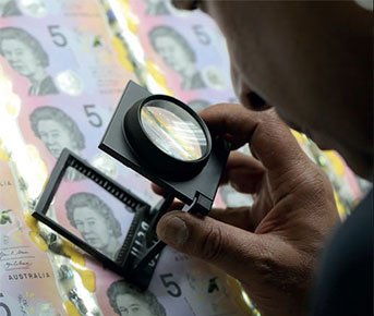 Photo: NPA printer inspects the new banknotes