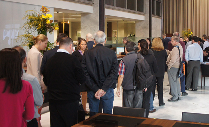 (Top) Visitors crowded the Head Office Banking Chamber on 1 September 2016 to be among the first to receive the new $5 banknote; (above) then Assistant Governor (Business Services) Michele Bullock (now Assistant Governor (Financial System)) interviewed on ABC television for the launch of the new $5 banknote, September 2016