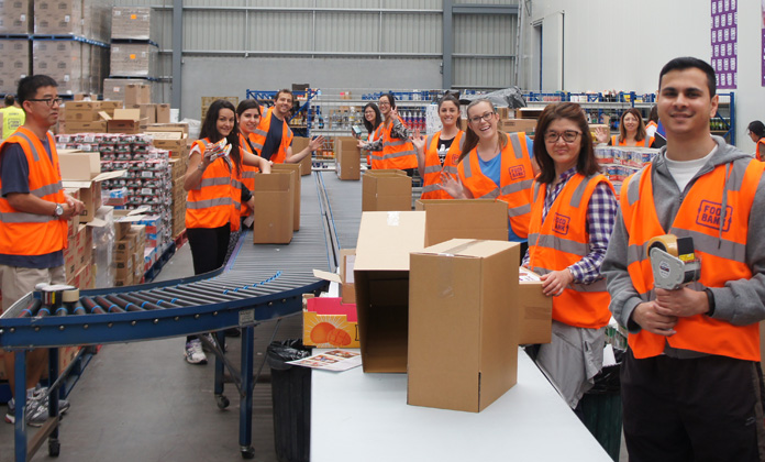 The Reserve Bank Benevolent Fund organises a Bank team to go to the Foodbank warehouse in Glendenning each year. During their 2016 visit they put together 600 hampers for Christmas, November 2016