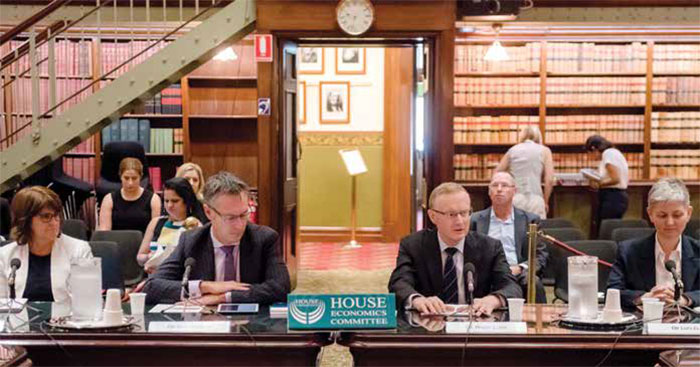 (Top, from left) Assistant Governor (Financial System) Michele Bullock, Deputy Governor Guy Debelle, Governor Philip Lowe and Assistant Governor (Economic) Luci Ellis at a hearing of the House of Representatives Standing Committee on Economics, Sydney, February 2018; (above) Deputy Governor Guy Debelle addresses the CEDA Mid-year Economic Update, Adelaide, July 2017