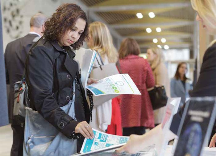 A teacher examines the Bank's new education resources, Sydney, June 2018