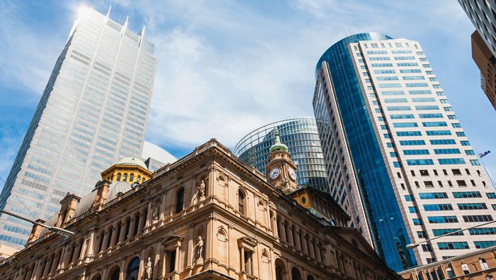 Tow high-rise buildings frame the upper portion of the Sydney's Town Hall
