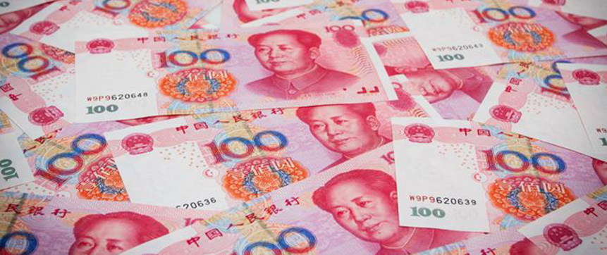 Chinese banknotes cover a table