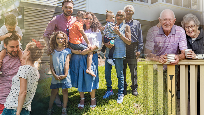 Family members spanning three generations gather outside.