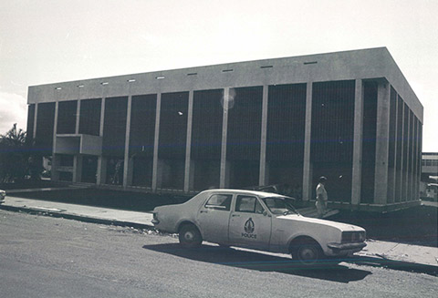 Exterior of the Darwin branch after Cyclone Tracy, 1974. The Bank’s building was relatively undamaged with only a couple of the sun shields gone and the front door missing in the aftermath of the cyclone.<br><br> <small>RBA Archives PN-009949</small>