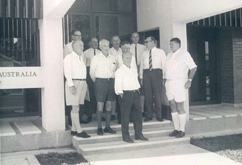 Reserve Bank Board members outside the Darwin branch, June 1968, from left to right: William Pettingell (later Sir); Henry Rowden; Sir Leslie Melville; John Phillips (later Sir); Sir Theo Kelly; Sir Richard Randall; Dr H C Coombs; Harry Knight (later Sir) as an observer; Donald Hibberd (later Sir); Sir William Gunn. <br><br> <small>RBA Archives PN-004721</small>